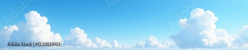 Cumulus clouds scattered across the abstract blue sky, airy, puffy, sky