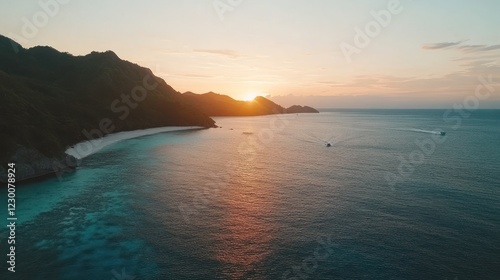 Sunset over tropical island beach and ocean