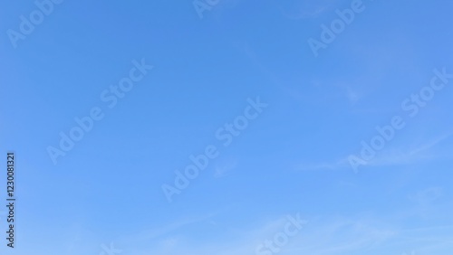 Serene Blue Sky with Subtle Cloud Formations