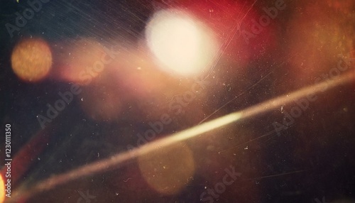Vintage retro photo overlay with dramatic lens optical flares, glowing glare effects, and subtle grunge textures, realistic scratches and dust particles, film noise and grain, bold red tint, abstract 