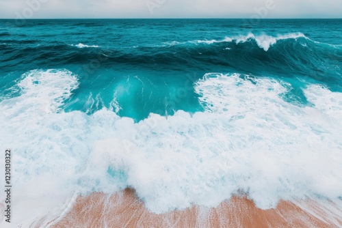 Turquoise Ocean Waves Crashing on a Sandy Beach Shoreline