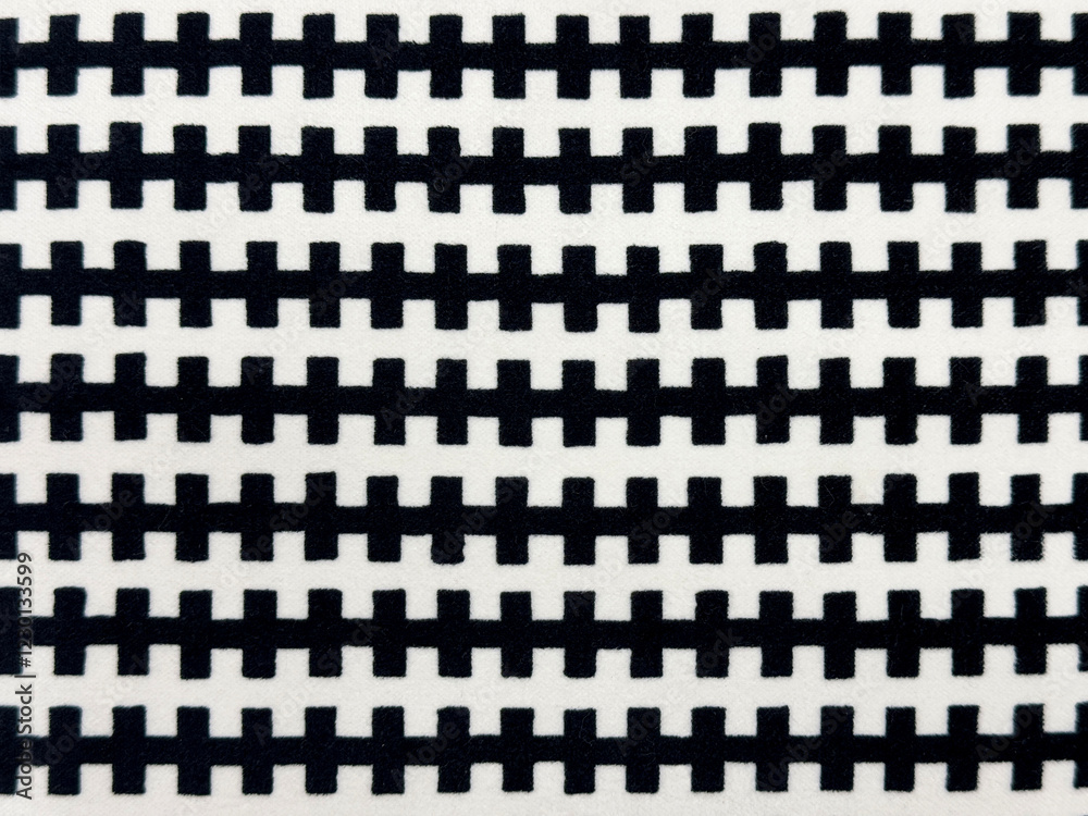 Close up of black and white fabric in zipper shape. Horizontal stripes zipper pattern seamless background texture. Close up of black and white fabric in zipper shape. Horizontal stripes zipper pattern seamless background texture.