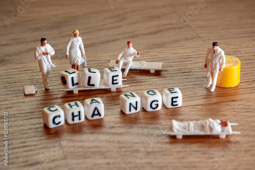 Removing white cubes with letters l and e of the word challenge creating new word change on wooden background with miniature figurines in doctor suites 