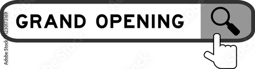 Search banner in word grand opening with hand over magnifier icon on white background