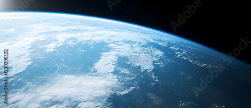 Earth as seen from space showcasing vibrant blue oceans and cloud patterns above a dark backdrop of outer space