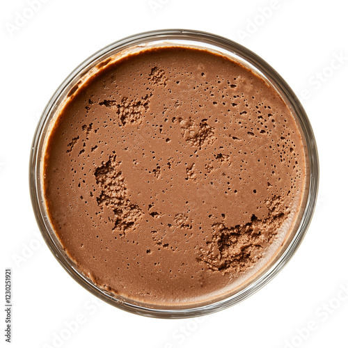 Top view of creamy chocolate mousse in transparent glass, showcasing its rich texture