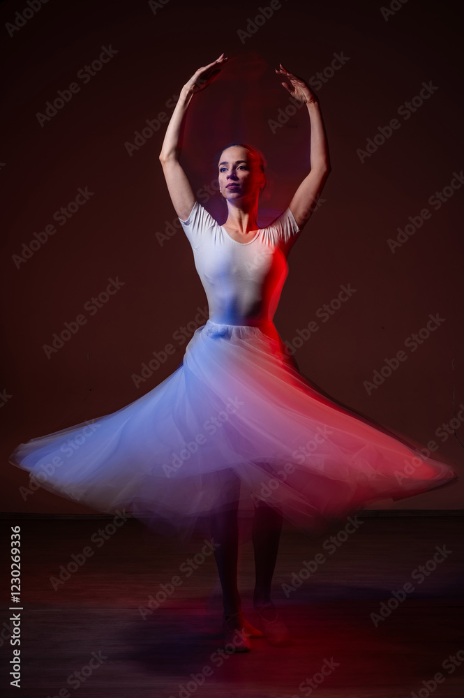 Caucasian woman dancing classical dance in tutu . Long exposure photo. 