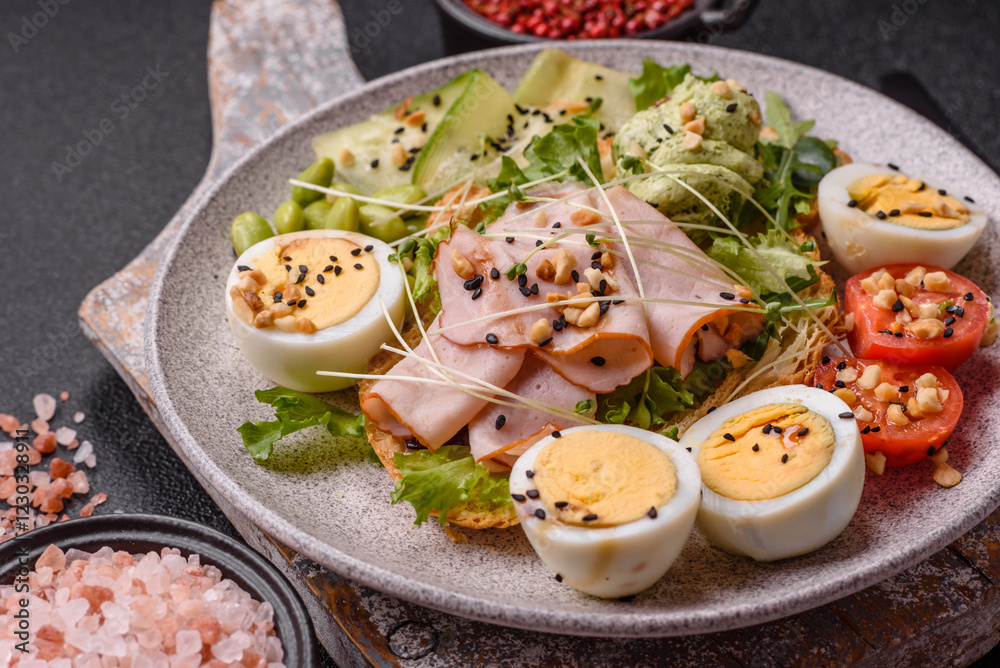 Healthy breakfast consisting of boiled eggs, slices of ham, tomatoes, green beans, aioli sauce Healthy breakfast consisting of boiled eggs, slices of ham, tomatoes, green beans, aioli sauce