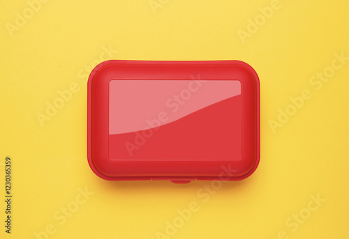 Plastic box on a yellow