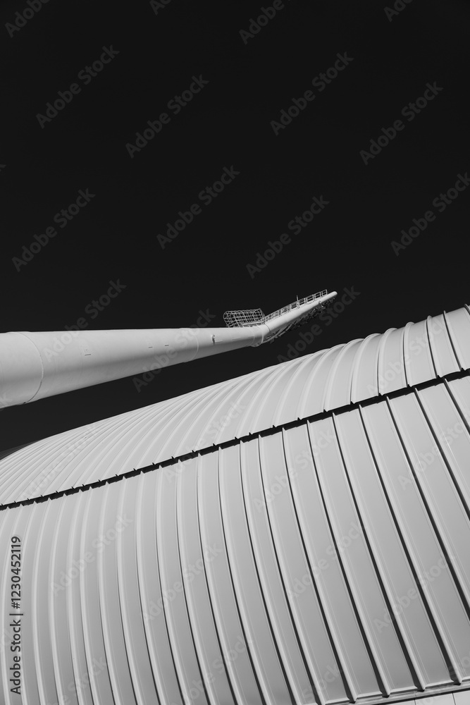 Fototapeta premium Minimalism, abstraction. A spotlight on the background of the stadium wall.