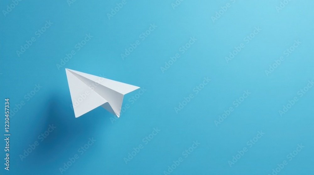 A solitary white paper airplane gracefully soars across a vibrant azure backdrop, symbolizing dreams of flight and boundless possibilities. A solitary white paper airplane gracefully soars across a vibrant azure backdrop, symbolizing dreams of flight and boundless possibilities.