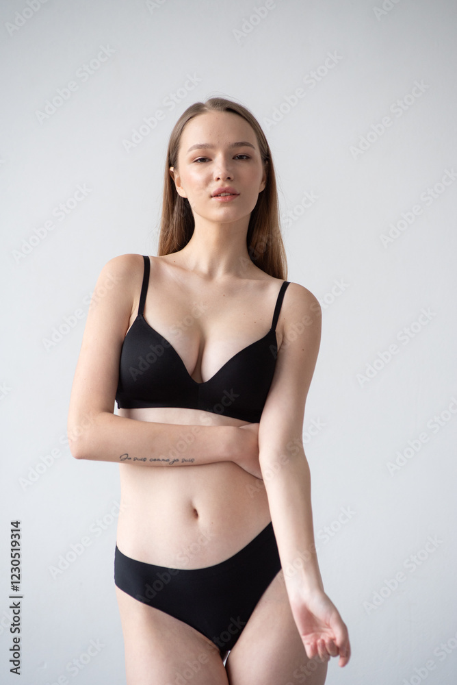 Casting snapshot of a fresh-faced model in simple black underwear, highlighting her natural features, body proportions, and confident stance. Ideal for agency scouting and professional portfolio updat Casting snapshot of a fresh-faced model in simple black underwear, highlighting her natural features, body proportions, and confident stance. Ideal for agency scouting and professional portfolio updat
