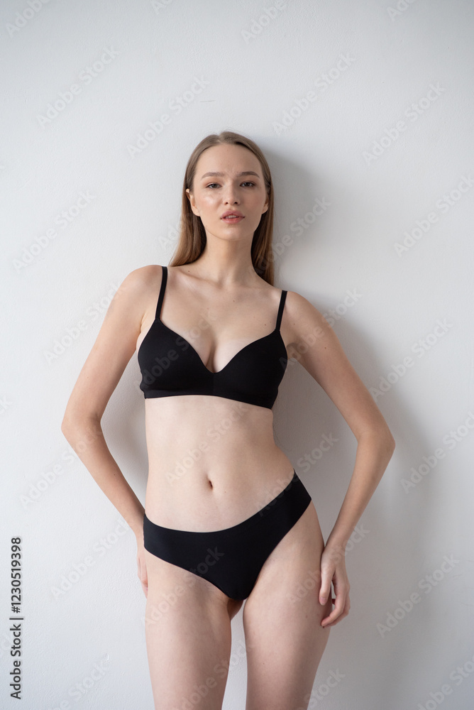 Casting snapshot of a fresh-faced model in simple black underwear, highlighting her natural features, body proportions, and confident stance. Ideal for agency scouting and professional portfolio updat Casting snapshot of a fresh-faced model in simple black underwear, highlighting her natural features, body proportions, and confident stance. Ideal for agency scouting and professional portfolio updat