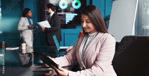 Reading, happy and woman with tablet, office and analysis of industry trends for trading or data analyst. Corporate, people or statistician with info for investment, research or plan for stock market