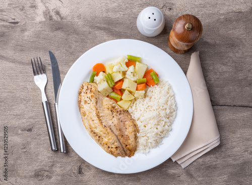 Grilled tilapia or saint peter with rice and vegetables