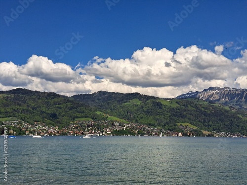A lake in the Swiss Alps. The Blue Lake in Switzerland. Snow-capped mountains near the lake. Spring.
