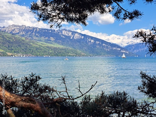 A lake in the Swiss Alps. The Blue Lake in Switzerland. Snow-capped mountains near the lake. Spring.
