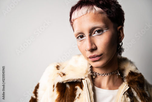 Portrait of woman with bold makeup looking at camera photo