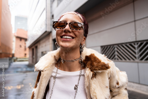 Cheerful stylish urban woman with sunglasses and fur coat photo