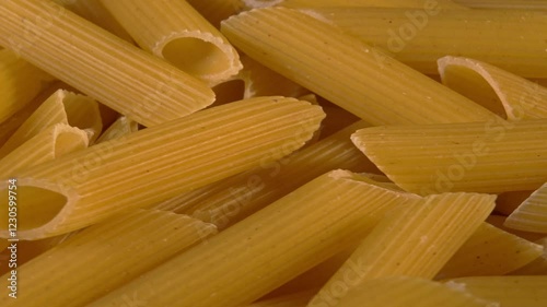 Uncooked Penne Pasta. Close UP. Rotation.