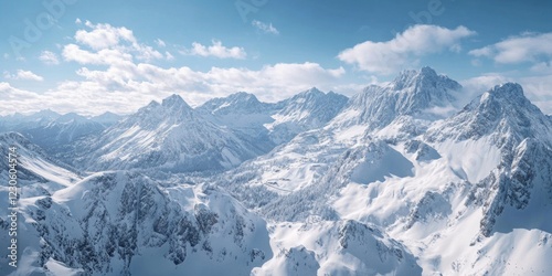 Awe-inspiring scenery of snowy mountains with peaks reaching the sky.