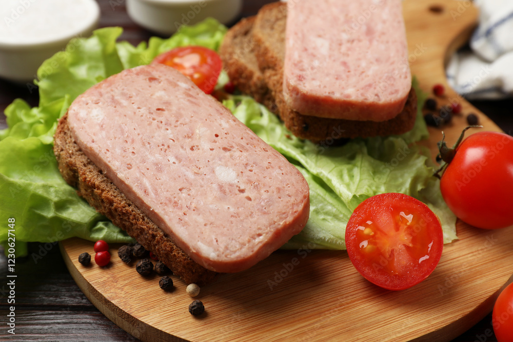 Tasty canned meat, bread, tomatoes, spices and lettuce on wooden table, closeup Tasty canned meat, bread, tomatoes, spices and lettuce on wooden table, closeup