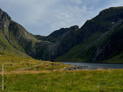 Small cottage and lake in mountains