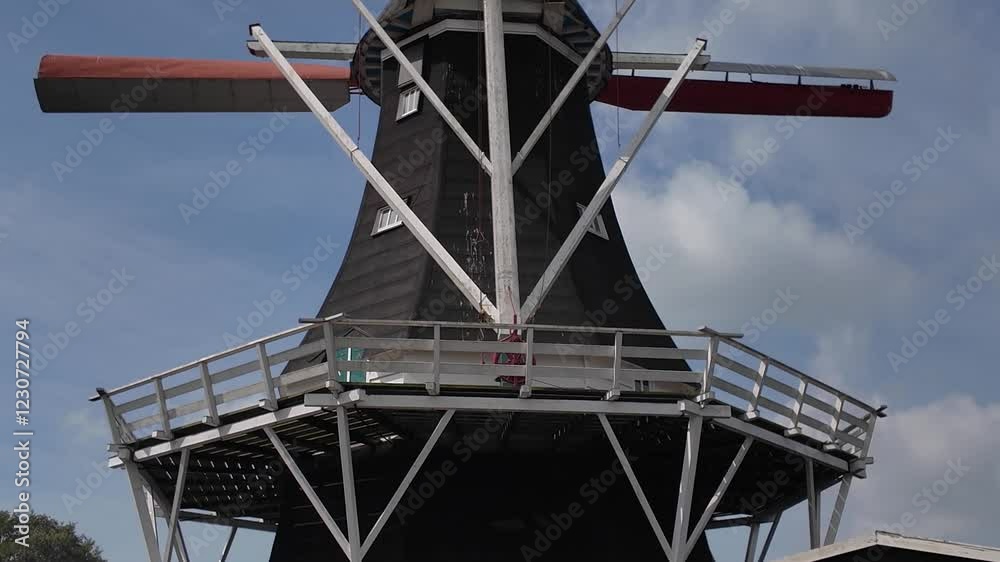 A wind mill in the neatherlands on a cloudy day