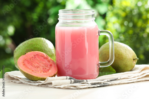 Wallpaper Mural Tasty guava juice in mason jar and fresh fruits on white table outdoors, closeup Torontodigital.ca
