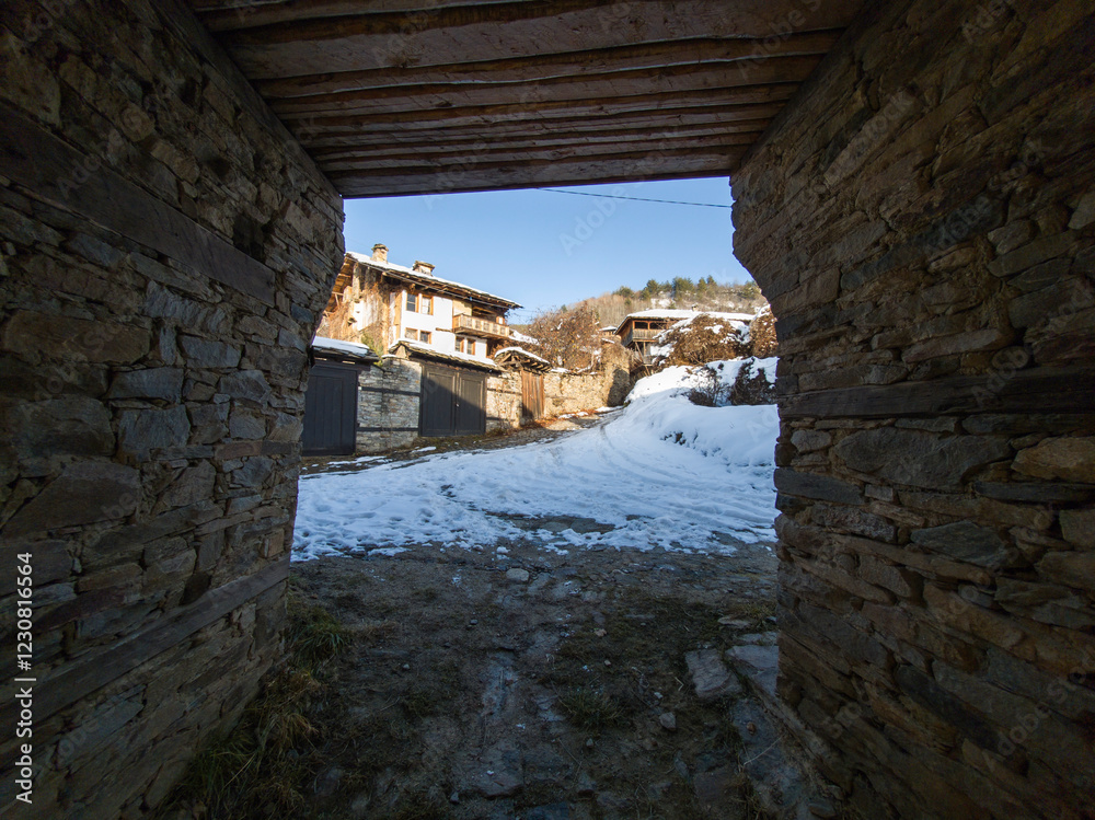 Fototapeta premium Winter Sunset view of Village of Kovachevitsa, Bulgaria