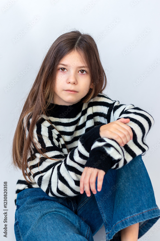 Portret of a cute child girl on the gray background Portret of a cute child girl on the gray background