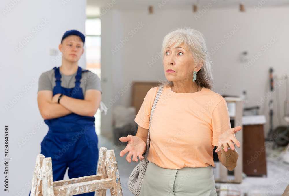 Fototapeta premium Portrait of an emotional mature woman who came to the apartment to check the repair work in the house
