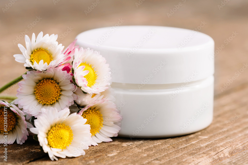 Close up of collagen cream in glass jar with daisies on wooden surface. Skin and body care beauty products. Mockup. Cosmetic packaging, creme moisturiser Close up of collagen cream in glass jar with daisies on wooden surface. Skin and body care beauty products. Mockup. Cosmetic packaging, creme moisturiser