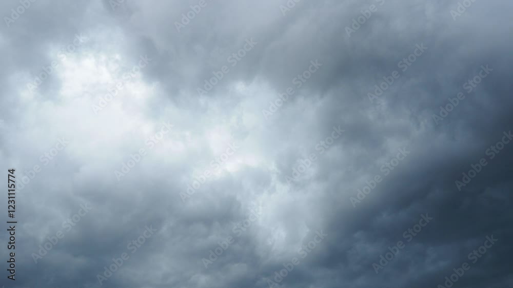A blanket of dark clouds envelops the skyline, signaling an impending storm. The atmosphere becomes tense as the wind picks up and evening sets in. Slow motion. Real time A blanket of dark clouds envelops the skyline, signaling an impending storm. The atmosphere becomes tense as the wind picks up and evening sets in. Slow motion. Real time