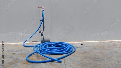 Blue hosepipe for watering plants