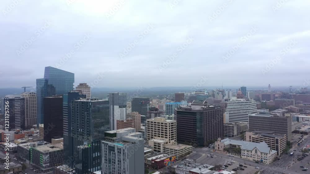 Drone is moving forward through a foggy city. Drone is moving forward through a foggy city.