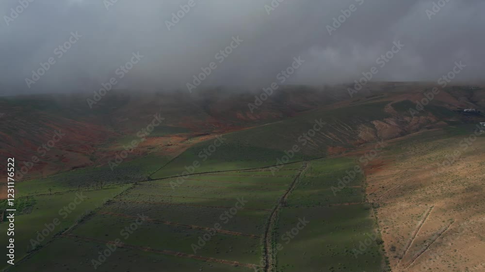 Aerial drone view of mountain sea and volcanoes in Lanzarote, Canary Islands, Spain