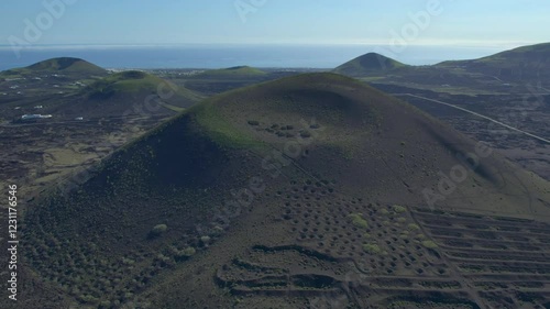 Aerial drone view of mountain sea and volcanoes in Lanzarote, Canary Islands, Spain