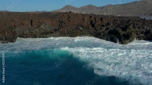 Aerial drone view of mountain sea and volcanoes in Lanzarote, Canary Islands, Spain