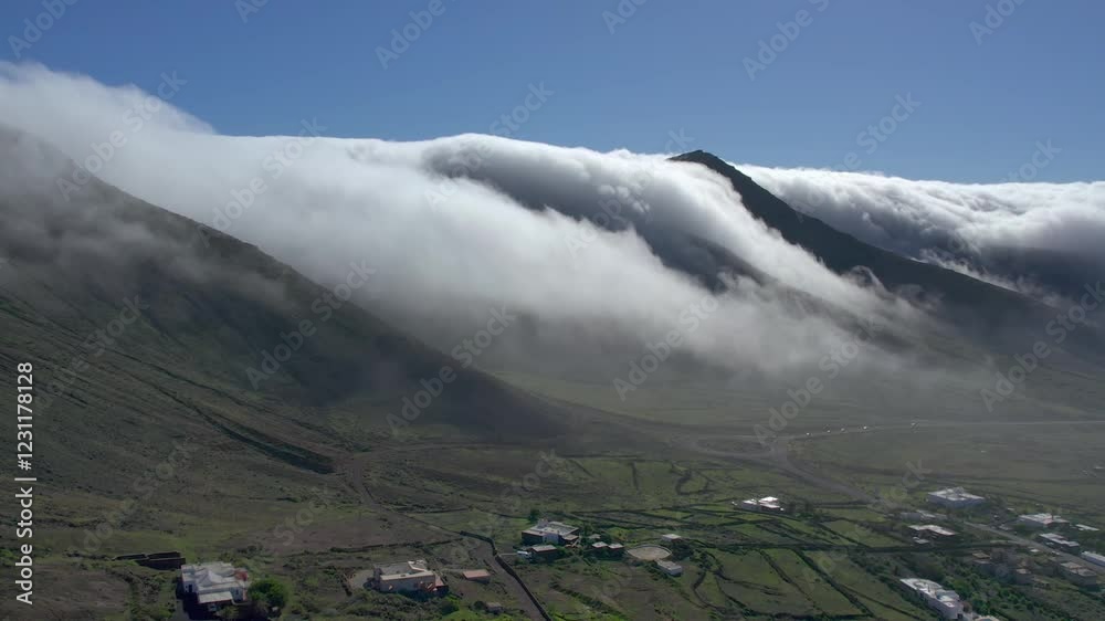 Aerial drone view of mountain sea and volcanoes in Lanzarote, Canary Islands, Spain
