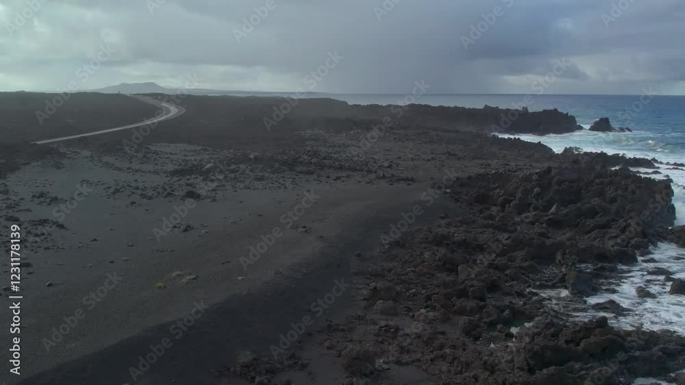 Aerial drone view of mountain sea and volcanoes in Lanzarote, Canary Islands, Spain Aerial drone view of mountain sea and volcanoes in Lanzarote, Canary Islands, Spain