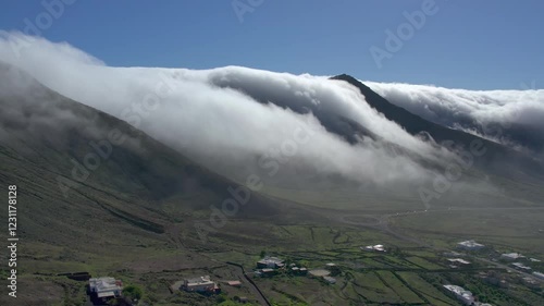 Aerial drone view of mountain sea and volcanoes in Lanzarote, Canary Islands, Spain