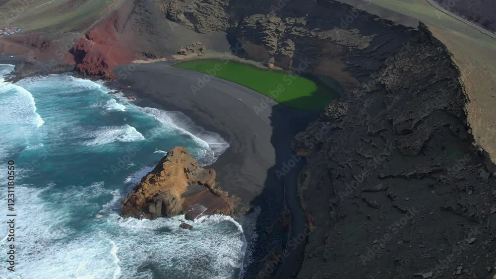 Aerial drone view of mountain sea and volcanoes in Lanzarote, Canary Islands, Spain