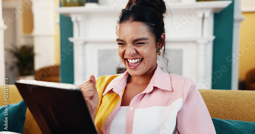 Woman, fist bump and tablet on sofa for email, dream job or promotion in living room of home. Celebration, achievement and tech with winner person in apartment for social media success or approval photo