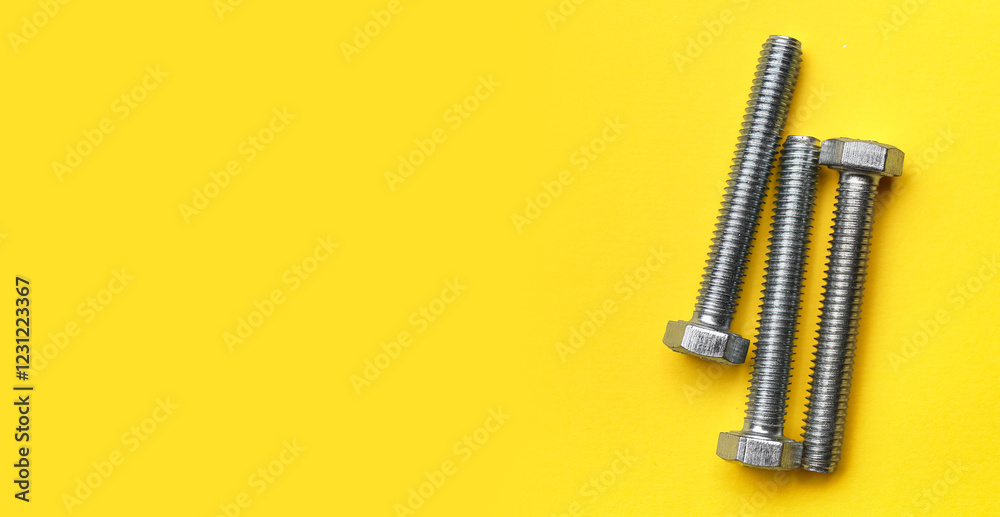 Tap bolts on yellow background Tap bolts on yellow background