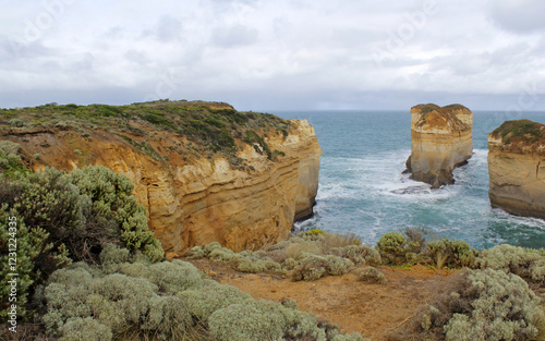 Rugged limestone cliffs and sea stacks at Loch Ard Gorge on the Great Ocean Road in Victoria, Australia photo