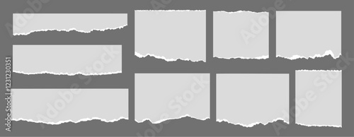 Set of paper note ripped strips on dark background. Paper page scraps with torn edges.