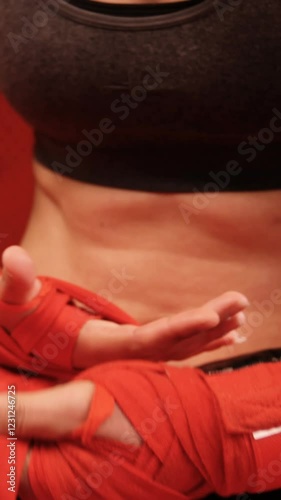 Wallpaper Mural Female boxer wearing red strap on wrist in fitness studio Torontodigital.ca