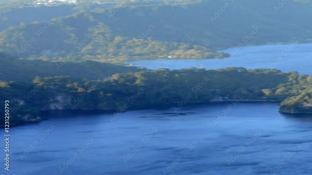 A captivating video of Lake Ilopango, El Salvador, highlighting its volcanic crater, tranquil waters, and vibrant daytime scenery. A captivating video of Lake Ilopango, El Salvador, highlighting its volcanic crater, tranquil waters, and vibrant daytime scenery.