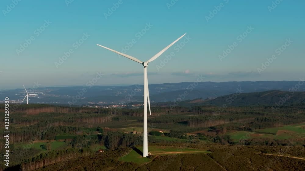 Wind Power In The Rural Mountains Near Lagoa de Fontecova In A Coruña, Galicia, Spain. Aerial Shot Wind Power In The Rural Mountains Near Lagoa de Fontecova In A Coruña, Galicia, Spain. Aerial Shot
